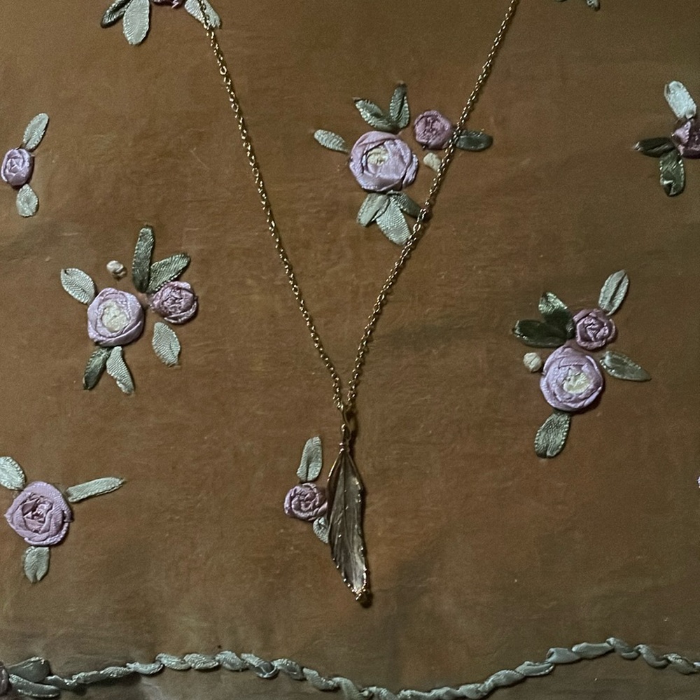 Golden feather necklace